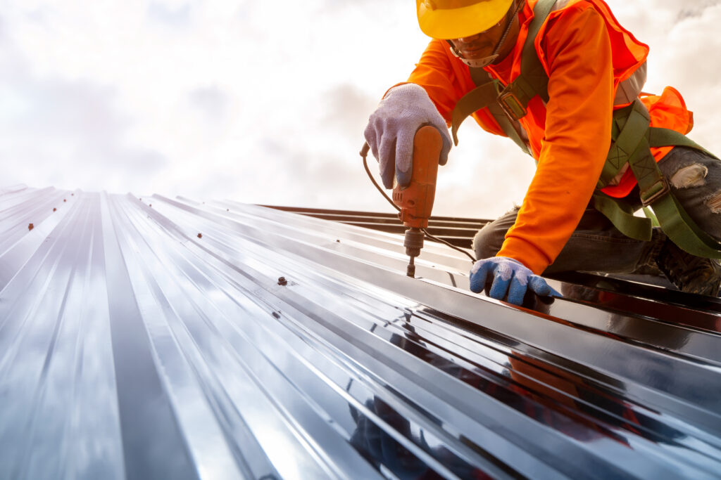 construction worker install new roof,roofing tools,electric dril